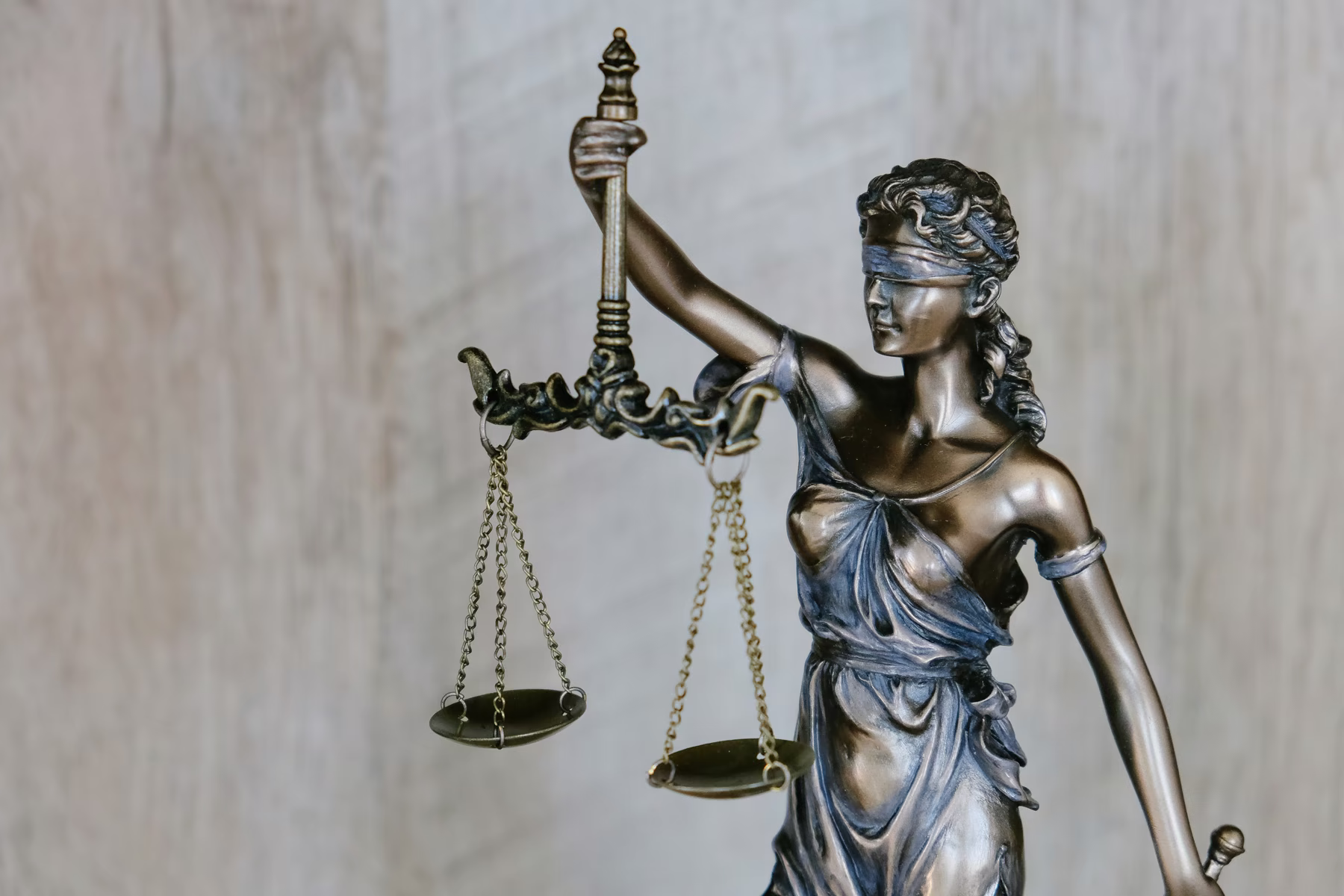 Lady Justice statue holding balanced scales